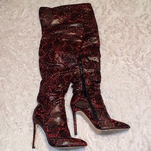 Over the knee snakeskin boots